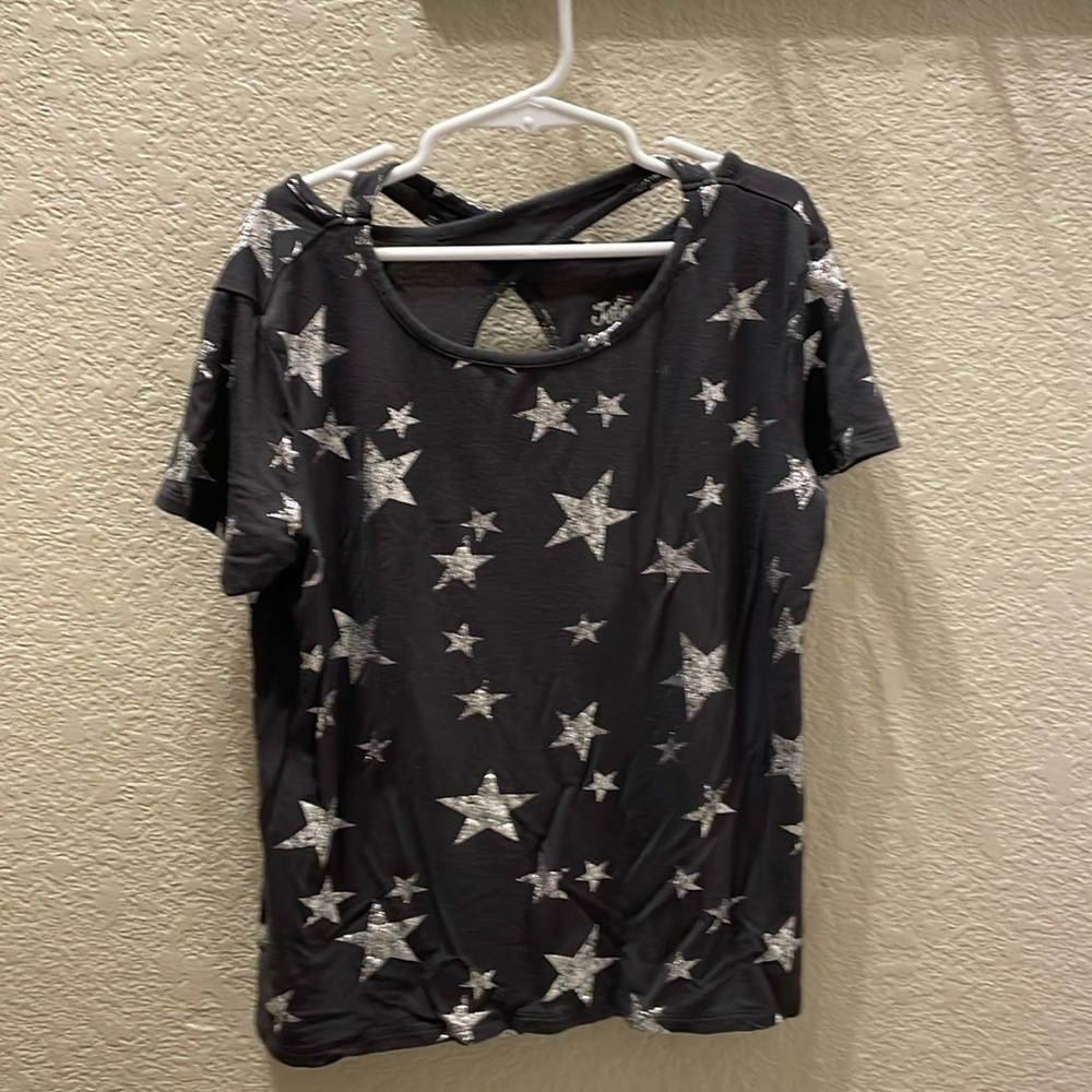 Girls JUSTICE distressed star blouse.